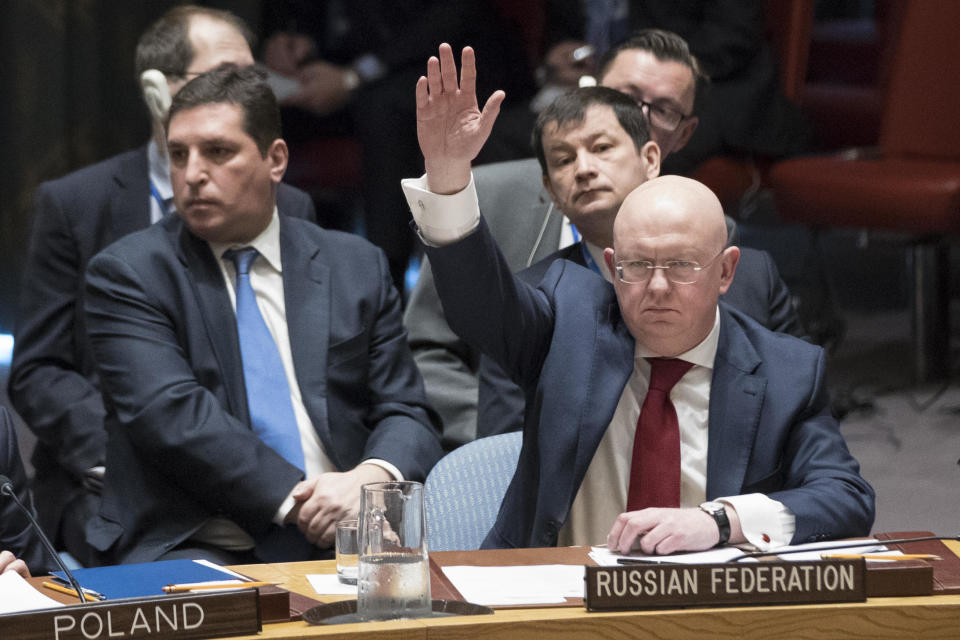 Russian Ambassador to the United Nations Vassily Nebenzia votes on a resolution during a Security Council meeting on the situation in Syria, in an April 14, 2018 file photo at United Nations headquarters in New York. / Credit: Mary Altaffer/AP