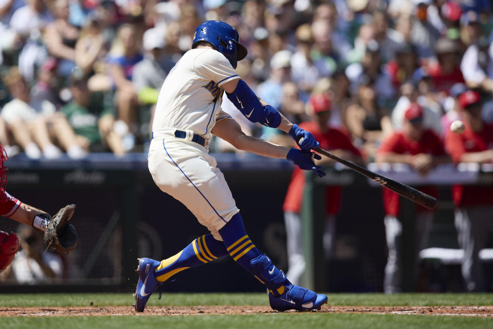 Seattle Mariners' Jesse Winker hits a grand slam against the Los Angeles Angels on a pitch from Tucker Davidson during third inning of a baseball game, Sunday, Aug. 7, 2022, in Seattle. (AP Photo/John Froschauer)