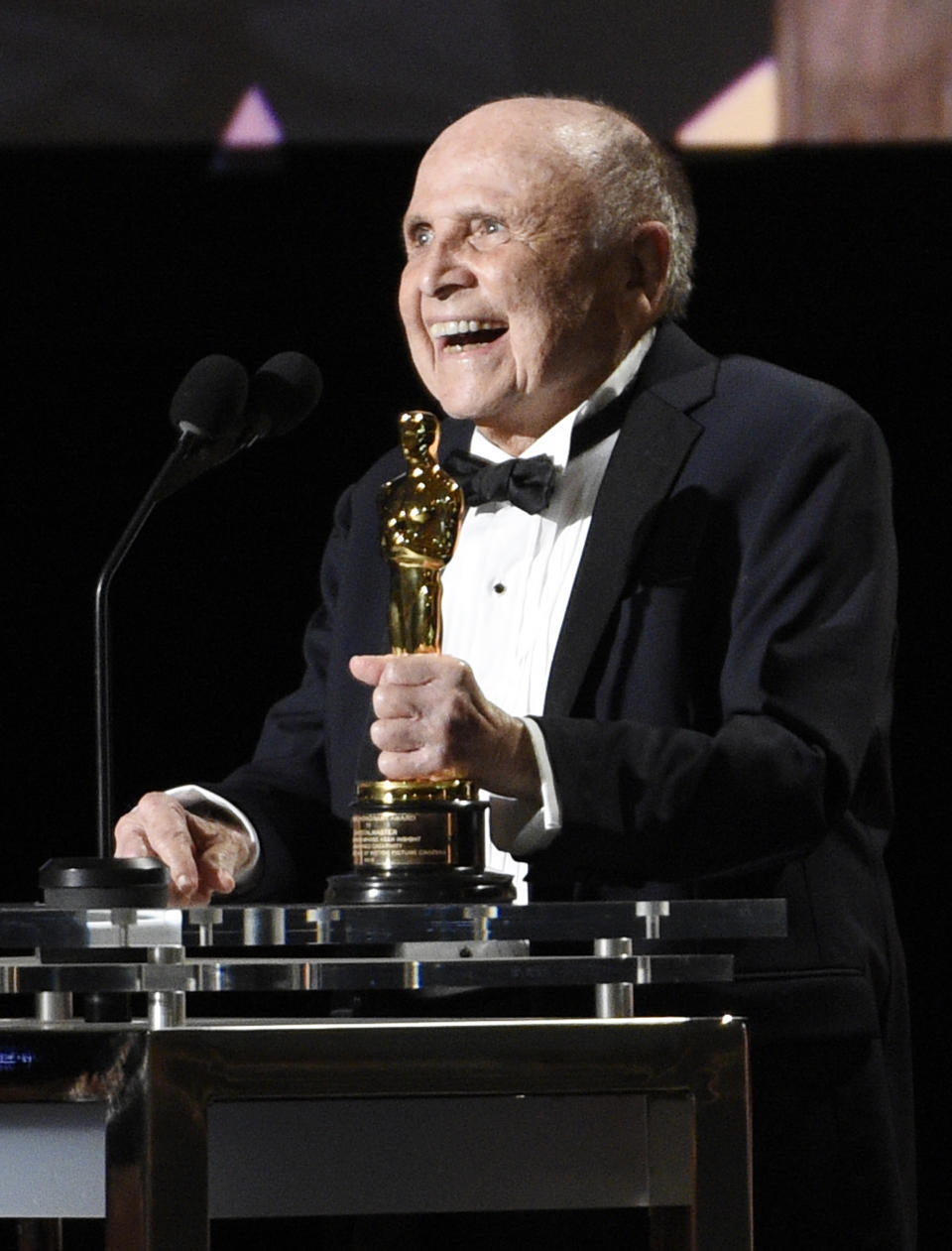 FILE - In this Saturday, Nov. 12, 2016 file photo, Honoree Lynn Stalmaster accepts his award at the 2016 Governors Awards at the Dolby Ballroom in Los Angeles. Lynn Stalmaster, the Oscar-winning casting director whose eye for talent helped launch the careers of John Travolta, Christopher Reeve, Richard Dreyfuss and many other actors, has died. He was 93.(Photo by Chris Pizzello /Invision/AP, File)