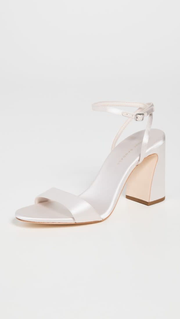 <em>Loeffler Randall Malia Curved-Heel Sandal in Cream, $350, </em><a href="https://rstyle.me/+hskUsDJ-4Fnkx13yE6pbpg" rel="nofollow noopener" target="_blank" data-ylk="slk:available here;elm:context_link;itc:0;sec:content-canvas" class="link ">available here</a>