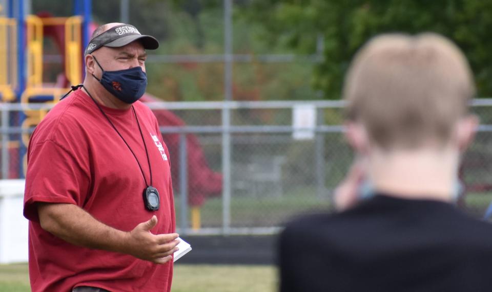 Norm Deep gives instructions to cross-country athletes during a fall 2020 practice in Clinton. Deep has been a longtime coach at the school with successful teams over the years.