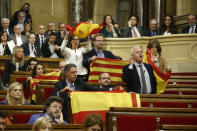 <p>Opposition Catalan lawmakers hold Spanish national flags and Estelada’s before leaving the chamber to boycott a vote on independence inside the Catalan parliament in Barcelona, Spain, Friday, Oct. 27, 2017. (Photo: Manu Fernandez/AP) </p>