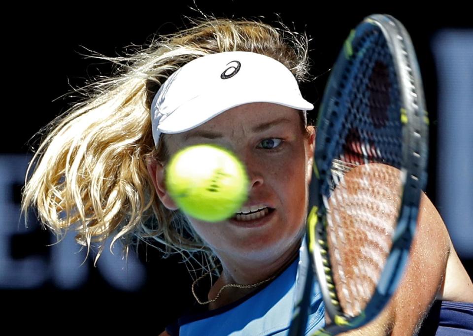 United States' Coco Vandeweghe makes a backhand return to Spain's Garbine Muguruza during their quarterfinal at the Australian Open tennis championships in Melbourne, Australia, Tuesday, Jan. 24, 2017. (AP Photo/Dita Alangkara)