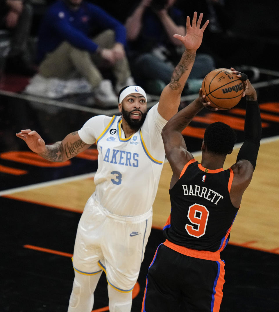 Los Angeles Lakers' Anthony Davis (3) defends a shot by New York Knicks' RJ Barrett (9) during the first half of an NBA basketball game Tuesday, Jan. 31, 2023, in New York. (AP Photo/Frank Franklin II)