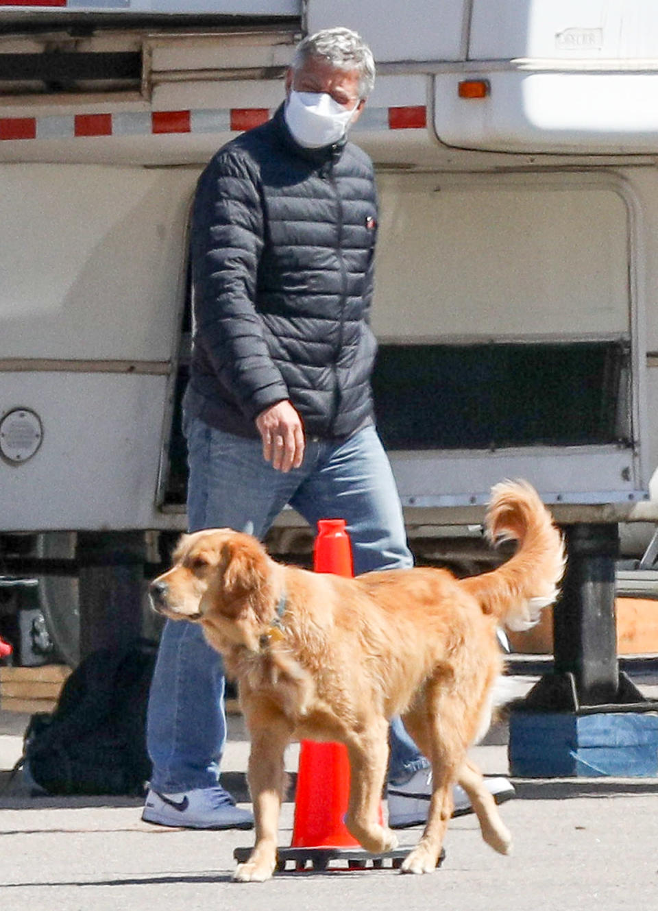 <p>George Clooney leaves his trailer with his beloved golden retriever on the last day of filming for <em>The Tender Bar</em> on Friday in Braintree, Massachusetts.</p>