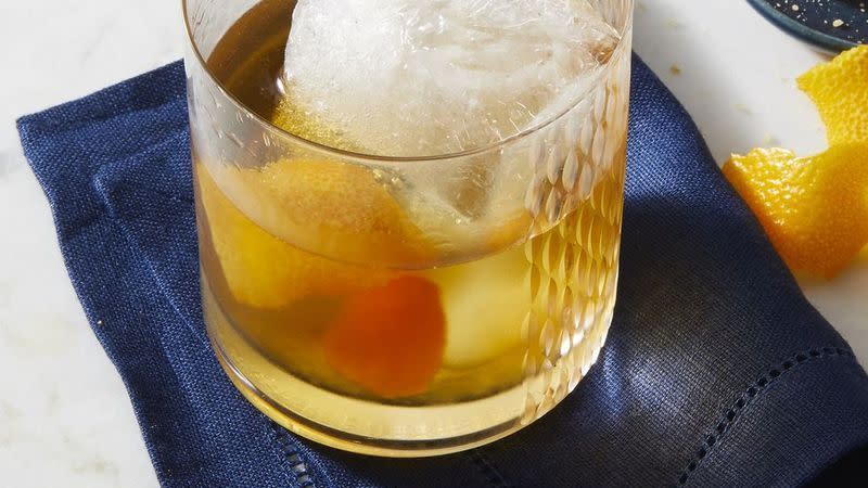 classic old fashioned cocktail with an orange rind
