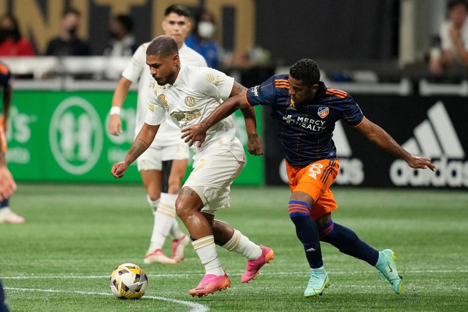 Sep 15, 2021; Atlanta, Georgia, USA; Atlanta United forward Josef Martinez (7) controls the ball against FC Cincinnati midfielder Allan Cruz (8) during the first half at Mercedes-Benz Stadium.