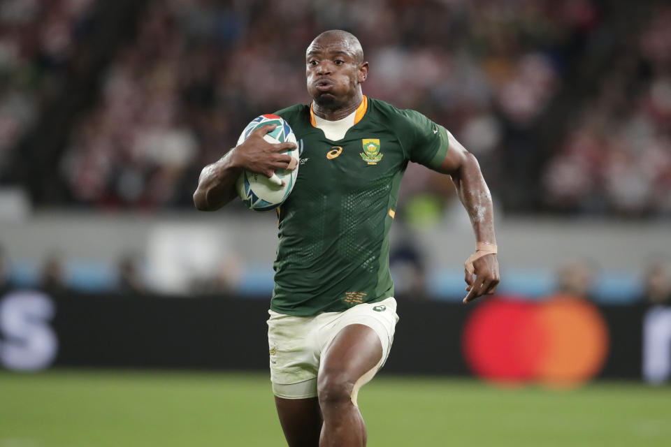 South Africa's Makazole Mapimpi runs for a try during the Rugby World Cup quarterfinal match at Tokyo Stadium between Japan and South Africa in Tokyo, Japan, Sunday, Oct. 20, 2019. (AP Photo/Jae C. Hong)