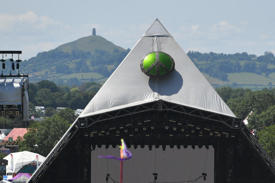 GLASTONBURY, ENGLAND - JUNE 22: A view of the Pyramid stage with Glastonbury Tor behind as final preparations are made during day 2 of Glastonbury Festival 2023 at Worthy Farm, Pilton on June 22, 2023 in Glastonbury, England. (Photo by Jim Dyson/Redferns)