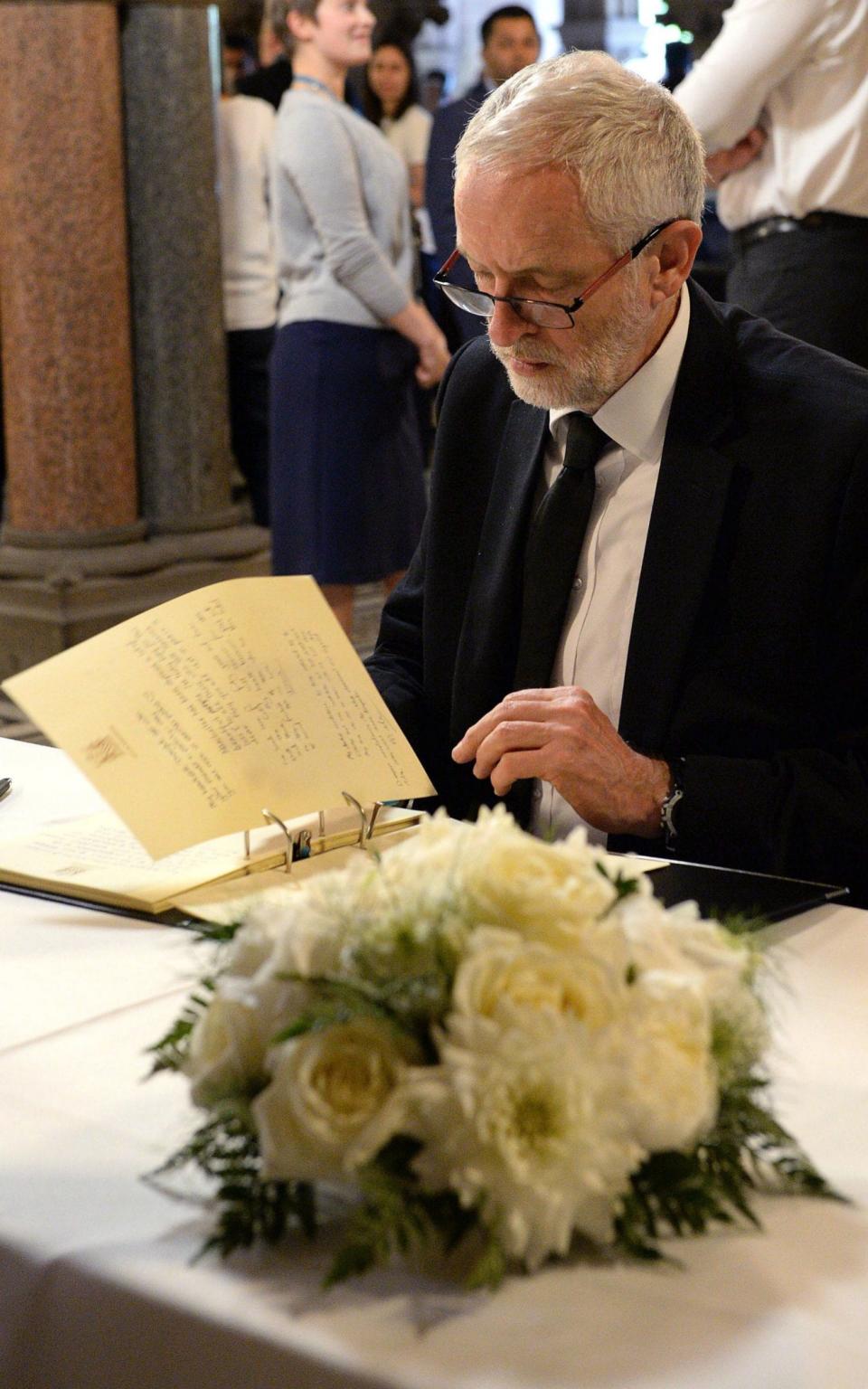 Jeremy Corbyn signs a book of condolence at Manchester Town Hall in Manchester - Credit:  Ben Birchall/PA