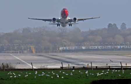 FILE PHOTO: An airplane takes off at Gatwick Airport, after the airport reopened to flights following its forced closure because of drone activity, in Gatwick, Britain, December 21, 2018. REUTERS/Toby Melville/File Photo