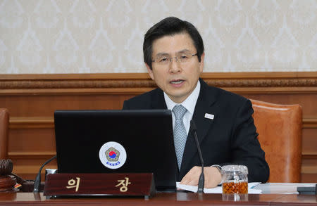 South Korea's Prime Minister and acting President Hwang Kyo-ahn makes a speech at a cabinet meeting in Seoul, South Korea March 15, 2017. Yonhap via REUTERS