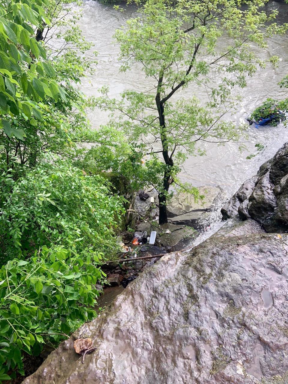 A view from top of the bluff at Natural Dam, Arkansas, where Mark Girdner's Baja Bug took a tumble and ended up in the flooded creek below. The Bug can be seen on the right side of the picture behind the tree limbs.