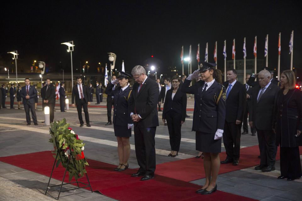 Canada's PM Harper stands in front of Knesset speaker Edelstein during a welcoming ceremony at the Knesset in Jerusalem