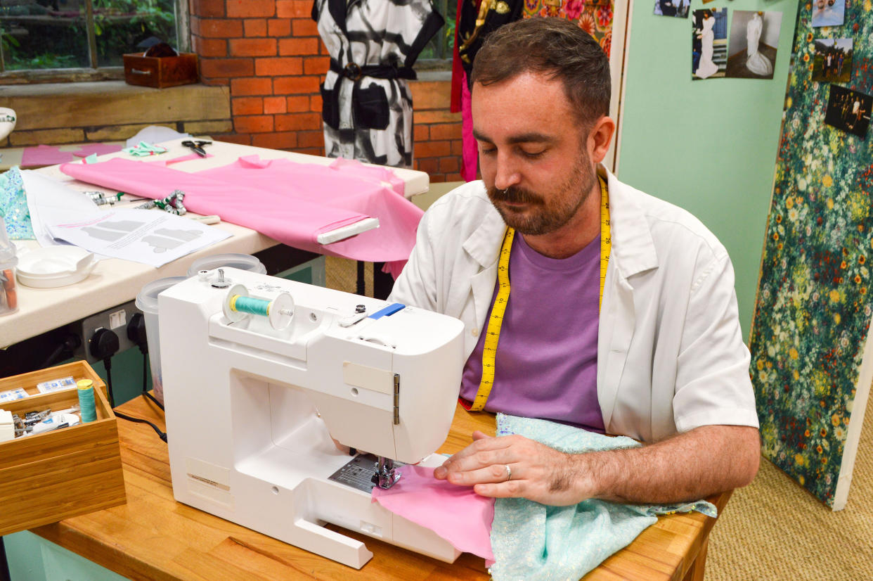 Luke, the winner of The Great British Sewing Bee at their machine