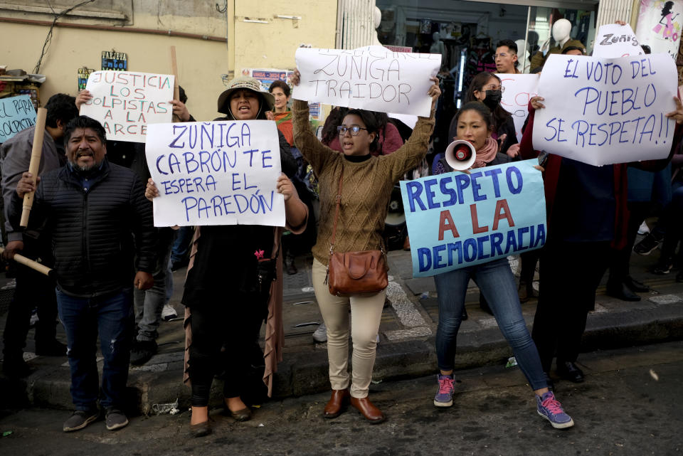 Supporters of President Luis Arce demonstrate outside the prosecutor's office demanding jail time for Juan Jose Zuniga, former commanding general of the army, in La Paz, Bolivia, Friday, June 28, 2024, two days after Army troops stormed the government palace in what President Luis Arce called a coup attempt. (AP Photo/Carlos Sanchez)