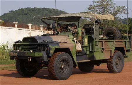 French soldiers are seen on their military vehicle at the Miskine district in Bangui December 10, 2013. REUTERS/Emmanuel Braun