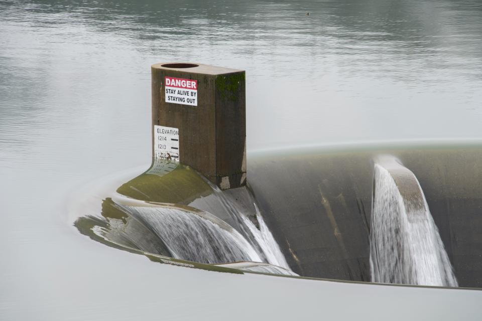 The Glory Hole at Whiskeytown Lake spilled over on Wednesday.