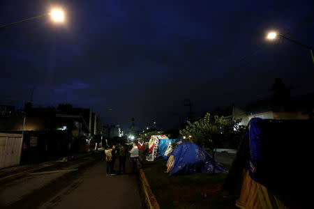 People who have been unable to return to their homes after they were damaged in an earthquake, camp out on a street, in Mexico City, Mexico September 27, 2017. REUTERS/Daniel Becerril