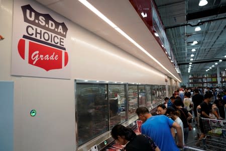 People visit at a U.S. hypermarket chain Costco Wholesale Corp store in Shanghai