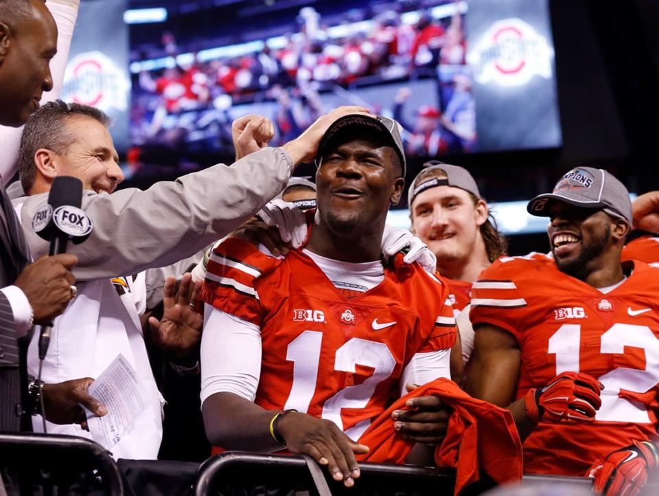 Coach Urban Meyer gives quarterback Cardale Jones a pat on the head after Ohio State crushed Wisconsin 59-0 in last season’s Big Ten championship game.Adam CairnsDispatch