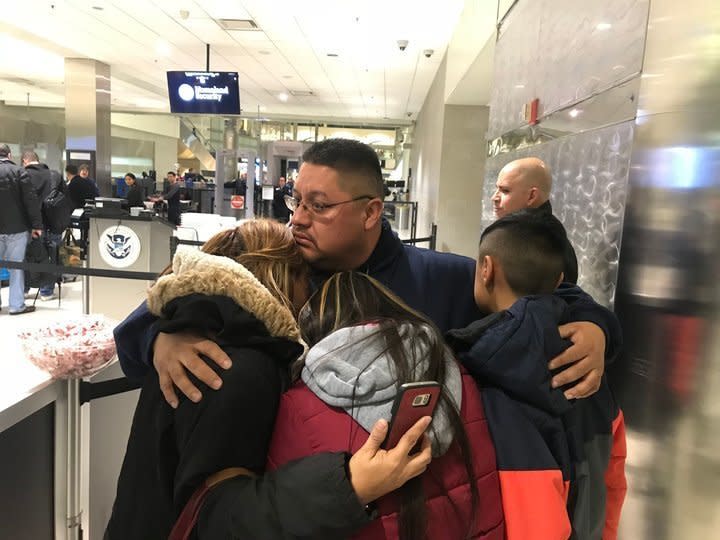 Jorge Garcia, 39, of Lincoln Park, Michigan, hugs his wife, Cindy Garcia, and their two children Jan. 15, 2018, at Detroit Metro Airport moments before being forced to board a flight to Mexico. (Photo: NIRAJ WARIKOO/DETROIT FREE PRESS/USA TODAY SPORTS IMAGES)