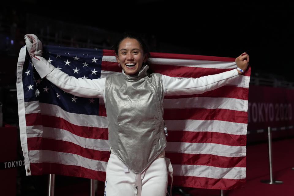 Lee Kiefer of the United States celebrates winning the women's individual Foil final competition against Inna Deriglazova of the Russian Olympic Committee at the 2020 Summer Olympics, Sunday, July 25, 2021, in Chiba, Japan. (AP Photo/Hassan Ammar)