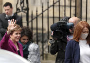 Scotland's First Minister and Scottish National Party leader Nicola Sturgeon poses for photographers, at Bute House in Edinburgh, Scotland. Sunday, May 9, 2021. British Prime Minister Boris Johnson has invited the leaders of the U.K.’s devolved nations for crisis talks on the union after Scotland’s pro-independence party won its fourth straight parliamentary election. Sturgeon said the election results proved a second independence vote for Scotland was “the will of the country." She said any London politician who stood in the way would be “picking a fight with the democratic wishes of the Scottish people.” (AP Photo/Scott Heppell)