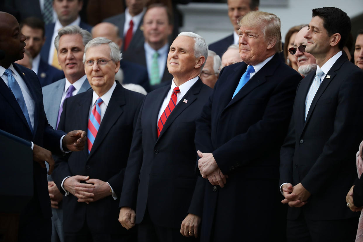 Sen. Tim Scott, R-S.C., delivers remarks with, from left, House Majority Leader Kevin McCarthy, R-Calif.; Senate Majority Leader Mitch McConnell, R-Ky.; Vice President Pence, President Trump and House Speaker Paul Ryan, R-Wis., at an event celebrating the passage of the Tax Cuts and Jobs Act on the South Lawn of the White House on Dec. 20, 2017. (Photo: Chip Somodevilla/Getty Images)