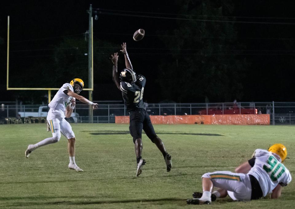 Quarterback Aidan Byrd (3) completes a pass to Jayvion Showers (4) in the end zone for a touchdown and a 13-0 Crusaders lead during the Pensacola Catholic vs Milton football game at Milton High School on Thursday, Sept. 1, 2022.