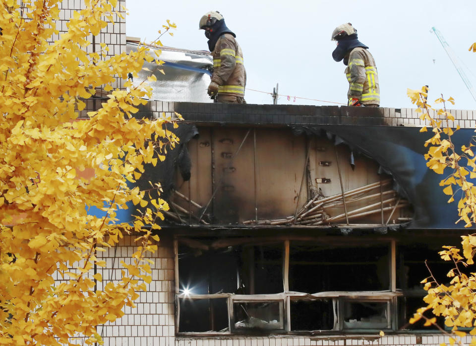 South Korean firefighters check the site of a fire in Seoul, South Korea, Friday, Nov. 9, 2018. A fire at a low-cost dormitory-style housing facility in central Seoul killed several people on Friday, fire authorities said. (Hong Hae-in/Yonhap via AP)