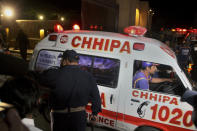 An ambulance transports an injured from the site of bomb blast in Quetta, Pakistan, Wednesday, April 21, 2021. A powerful bomb went off in the parking area of a five-star Serena hotel in the southwestern city of Quetta on Wednesday, wounding some people, police said. (AP Photo/Arshad Butt)