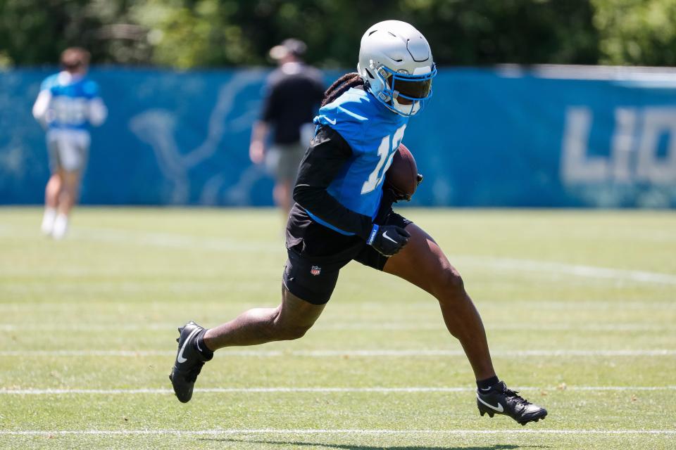 Detroit Lions wide receiver Daurice Fountain (12) practices during OTAs at Detroit Lions headquarters and training facility in Allen Park on Thursday, May 30, 2024.