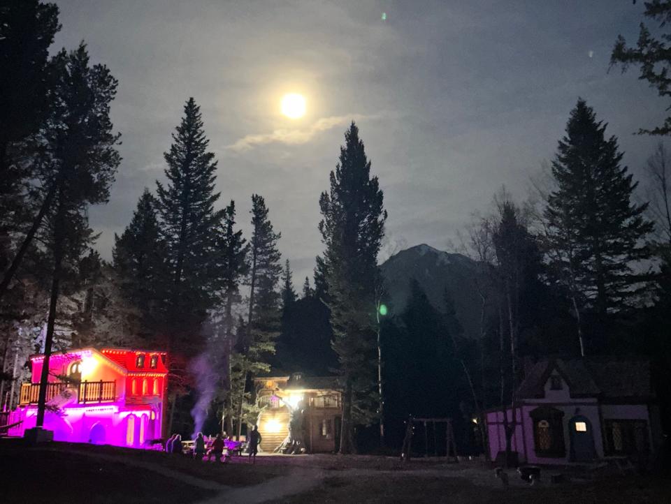 storybook square at night under full moon