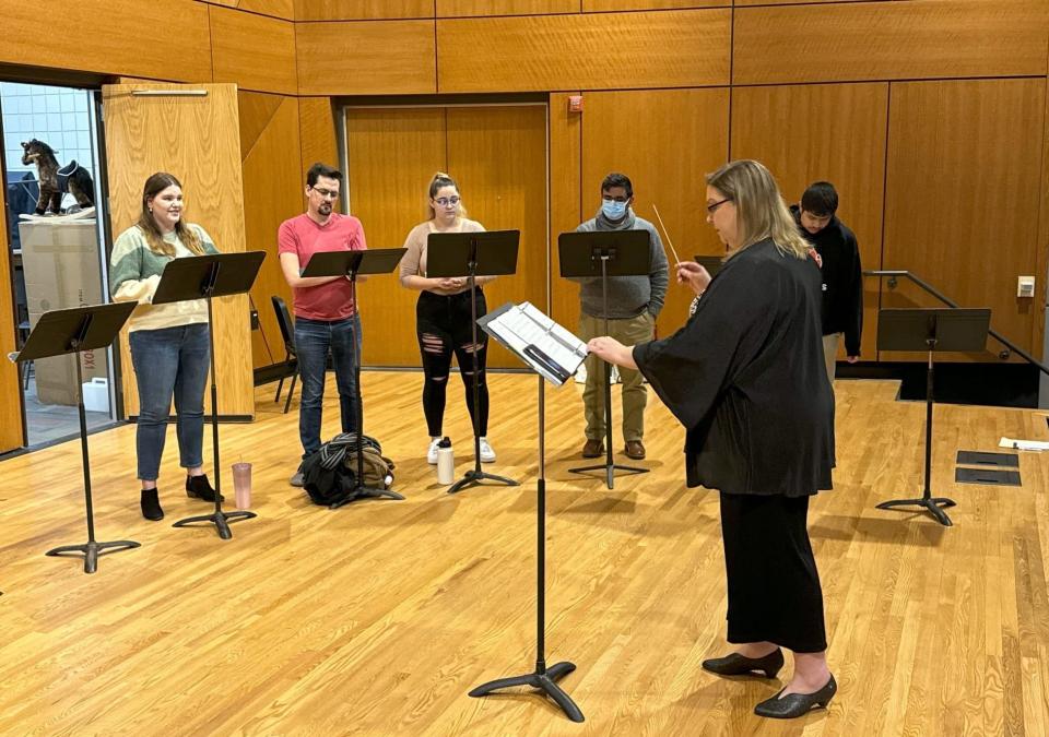 University of South Dakota music professor Tracelyn Gesteland runs through rehearsal with students at Colton Recital Hall in Vermillion, S.D., preparing for a spring production. "She moves mountains," USD Opera performer Marlise Ahuna said of Gesteland. "She gets the best out of all us."