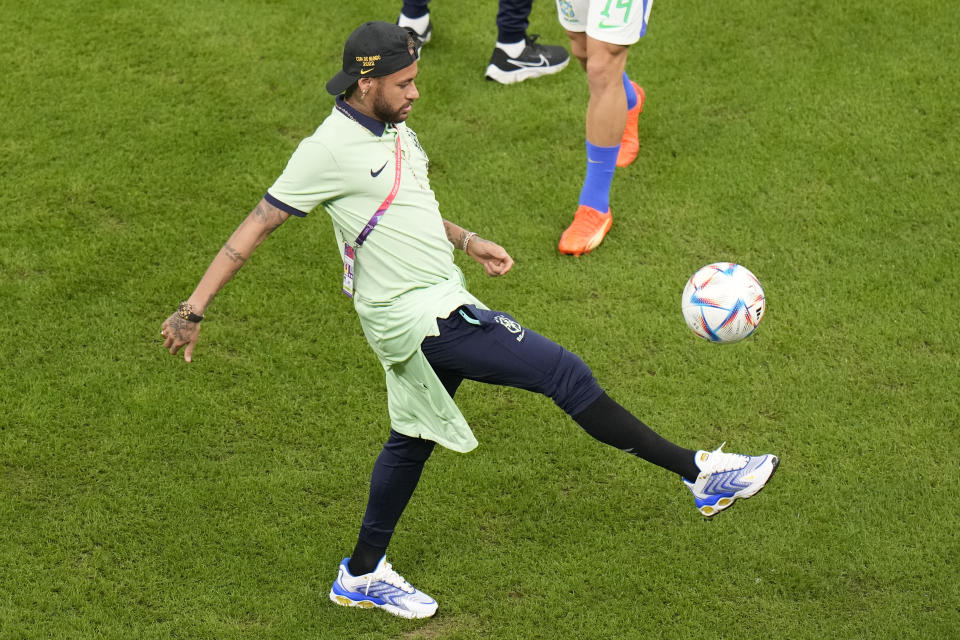 Brazil's Neymar jiggles before the World Cup group G soccer match between Cameroon and Brazil, at the Lusail Stadium in Lusail, Qatar, Friday, Dec. 2, 2022. (AP Photo/Alessandra Tarantino)