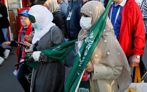 Supporters of the Saudi national soccer team leave after the match - Credit: Reuters