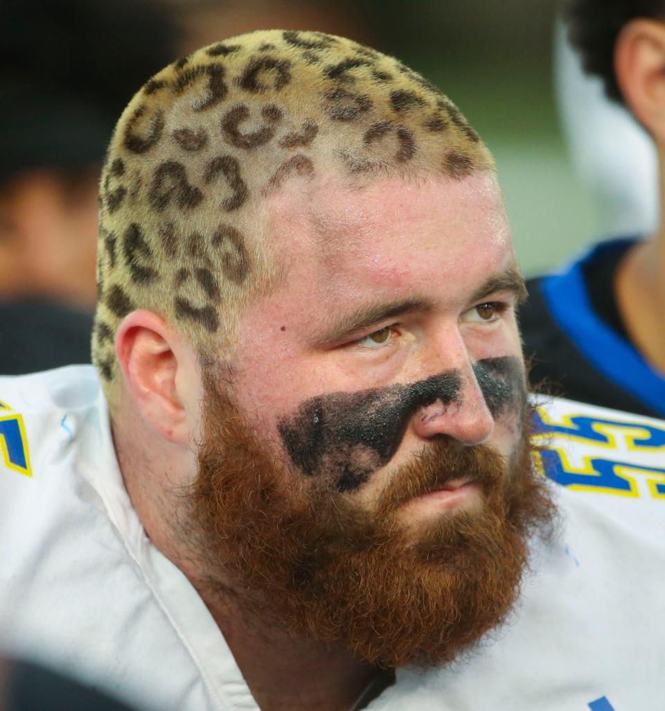 Delaware offensive lineman Brock Gingrich takes in his coach's comments after the Blue and White Spring Game capping spring drills, Friday, April 21, 2023 at Delaware Stadium.