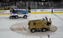 Ice resurfacers are used between periods during Game 2 of the NHL hockey Stanley Cup Finals between the Florida Panthers and the Vegas Golden Knights, Monday, June 5, 2023, in Las Vegas. Ice maintenance is generally the same across the league. Technicians work to make sure the ice — 1.25 to 1.5 inches thick — is the right temperature and consistency so that the puck slides smoothly and the players can slice along the ice with no problems. But with the Stanley Cup Final between the Las Vegas Golden Knights and Florida Panthers taking place in two of the hottest markets in the country in South Florida and Las Vegas, making sure outside conditions don't compromise the ice is an all-day process.(AP Photo/Abbie Parr)