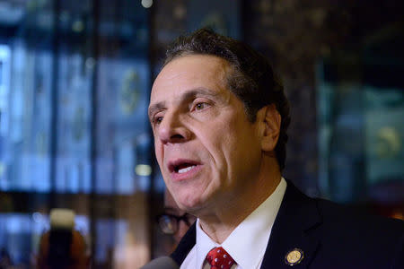 FILE PHOTO: Andrew Cuomo, Governor of New York, speaks to members of the press at Trump Tower in New York City, U.S. January 18, 2017. REUTERS/Stephanie Keith/File Photo