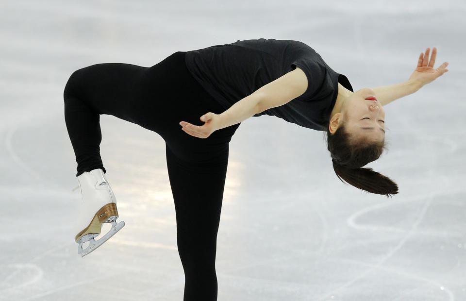Figure skater Yuna Kim of South Korea skates in the practice rink at the 2014 Winter Olympics, Thursday, Feb. 13, 2014, in Sochi, Russia. (AP Photo/Vadim Ghirda)