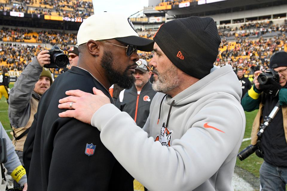 Pittsburgh Steelers head coach Mike Tomlin, left, and Cleveland Browns head coach Kevin Stefanski meet on the field following an NFL football game in Pittsburgh, Sunday, Jan. 8, 2023. The Steelers won 28-14. (AP Photo/Don Wright)