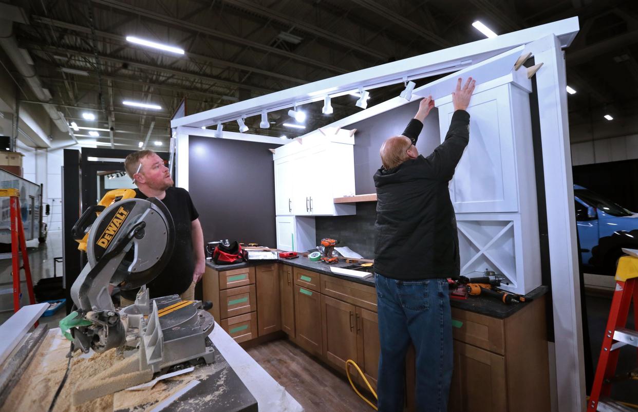 John Turner, left Craig Perkins from GMH Construction, set up the exhibit for Bliffert Lumber & Hardware at the NARI Spring Home Improvement Show at State Fair Park on Thursday, Feb. 16, 2023.  The show with over 150 vendors, runs Feb.17-19. For more information on the show, go to: NARIMilwaukeeHomeShow.com