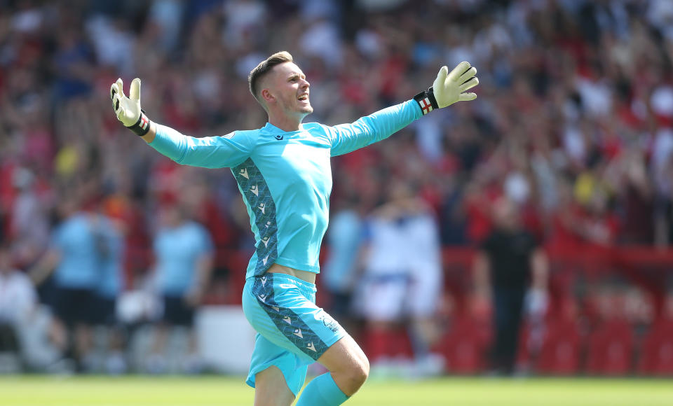 This photo shows Nottingham Forest goalkeeper Dean Henderson celebrating during his side's Premier League victory over West Ham. 