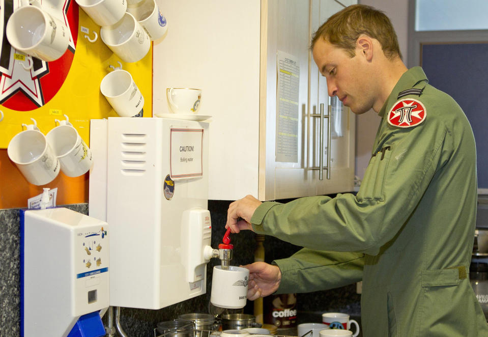 This is an undated handout photo issued by www.dukeanduchessofcambridge.org on Tuesday Nov. 20, 2012 of Britain's Prince William making a cup of tea whilst working as a helicopter search and rescue pilot at RAF Valley on Anglesey, Wales. The picture show a typical "day in the life" for Prince William in his work flying RAF Sea King helicopters from their base at RAF Valley on Anglesey, north Wales. From planning and preparing for any emergency callout to resting with his colleagues during "downtime", the exclusive pictures give an insight into the life of Flight Lieutenant Wales in his day-job as a Search and Rescue (SAR) pilot. (AP Photo/ SAC Faye Storer/MoD, www.dukeanduchessofcambridge.org) NO ARCHIVE EDITORIAL USE ONLY