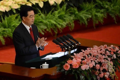 Hu Jintao addresses delegates at the opening of the 18th Communist Party congress in Beijing. President Hu called Thursday for a new Chinese growth model, marked by greater domestic demand and private enterprise, to ensure the long-term health of the world's second largest economy