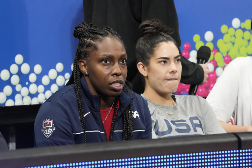United States' Kelsey Plum at right and Chelsea Gray in blue look on before their game against Puerto Rico at the women's Basketball World Cup in Sydney, Australia, Friday, Sept. 23, 2022. (AP Photo/Mark Baker)