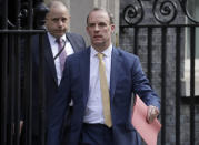 Britain's Secretary of State for Foreign Affairs, Dominic Raab, leads cabinet members as they leave 10 Downing Street after a meeting as British Prime Minister Boris Johnson was moved to intensive care after his coronavirus symptoms worsened in London, Tuesday, April 7, 2020. Johnson was admitted to St Thomas' hospital in central London on Sunday after his coronavirus symptoms persisted for 10 days. Having been in hospital for tests and observation, his doctors advised that he be admitted to intensive care on Monday evening. The new coronavirus causes mild or moderate symptoms for most people, but for some, especially older adults and people with existing health problems, it can cause more severe illness or death.(AP Photo/Matt Dunham)