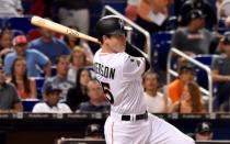 Sep 18, 2017; Miami, FL, USA; Miami Marlins third baseman Brian Anderson (55) follows through on a two run RBI triple in the fifth inning against the New York Mets at Marlins Park. Mandatory Credit: Steve Mitchell-USA TODAY Sports