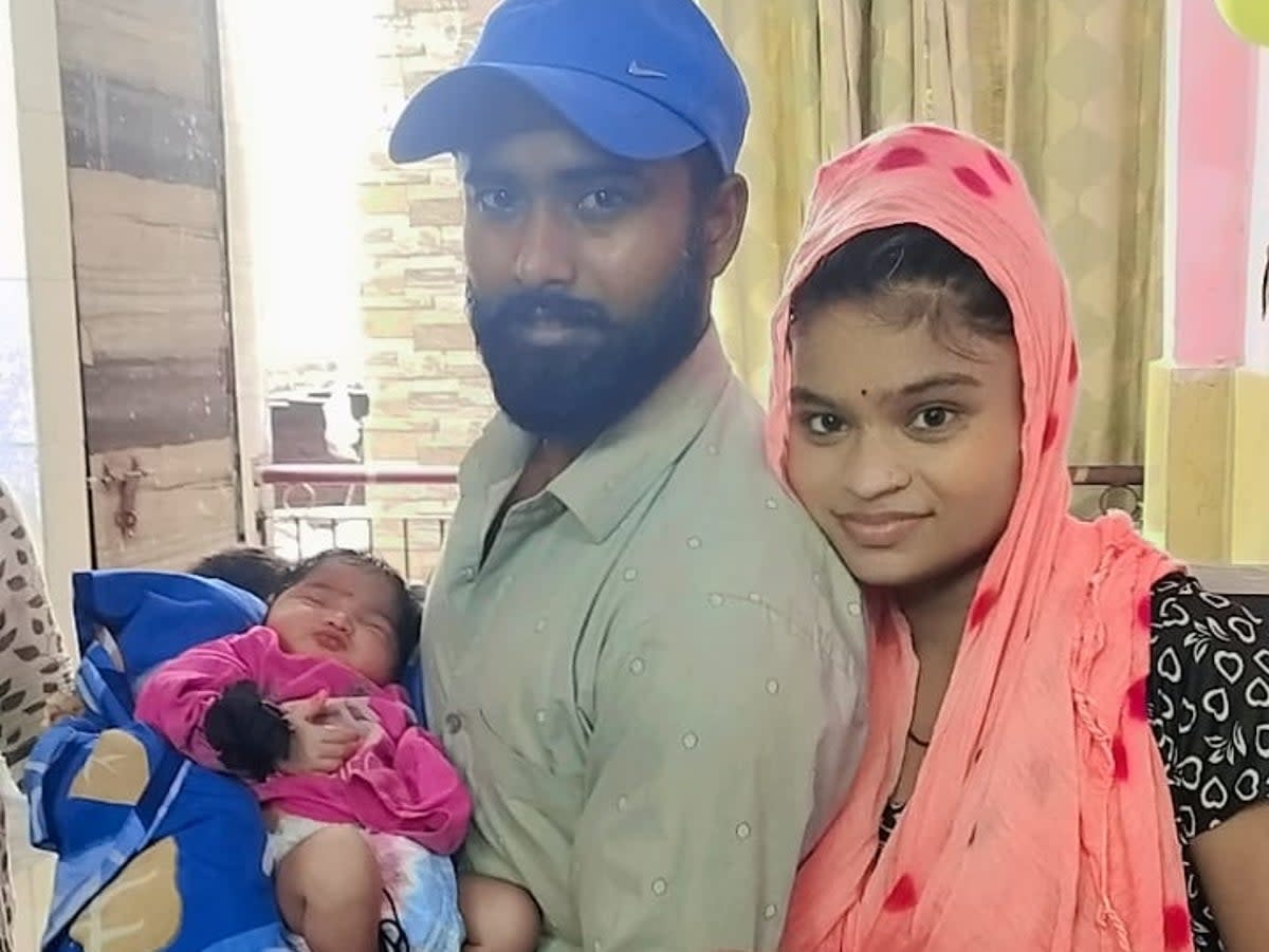 Newborn baby Ruhi, pictured here before the fire at home with her parents, is one of seven killed in the blaze  (Supplied by Vineeta Kumari)